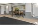 A decorative foyer showcasing a wooden table with flower arrangements, and a large mirror at 970 Sidney Marcus Ne Blvd # 2408, Atlanta, GA 30324