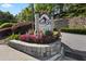 Attractive Lenox Villas Condominiums sign with colorful flowers, enhancing the property's curb appeal at 970 Sidney Marcus Ne Blvd # 2408, Atlanta, GA 30324