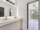 Bathroom with double sinks and a view to a bedroom at 191 Darwish Dr, Mcdonough, GA 30252