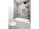 Modern bath features a square shower head and gray tile at 191 Darwish Dr, Mcdonough, GA 30252