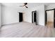 Large bedroom with a fan, features modern flooring and a walk-in closet at 191 Darwish Dr, Mcdonough, GA 30252