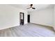 Bedroom featuring modern flooring and a peek into an ensuite bathroom at 191 Darwish Dr, Mcdonough, GA 30252