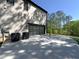 Modern home with brick exterior, concrete driveway and garage door facing grassy lawn at 191 Darwish Dr, Mcdonough, GA 30252