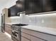 Modern kitchen featuring wood cabinets, stainless steel appliances, and a marble countertop at 191 Darwish Dr, Mcdonough, GA 30252