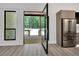 Kitchen showcasing stainless steel appliances and glass door leading to outdoor deck and greenery at 191 Darwish Dr, Mcdonough, GA 30252