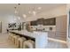 Modern kitchen featuring a large center island with barstool seating and stainless steel appliances at 191 Darwish Dr, Mcdonough, GA 30252