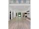 Bright, open-concept living room with modern finishes, and a soaring two-story ceiling with outdoor views at 191 Darwish Dr, Mcdonough, GA 30252