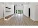 Bright, open-concept living room, modern kitchen, and a soaring two-story ceiling with outdoor views at 191 Darwish Dr, Mcdonough, GA 30252
