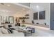 Bright, open-concept living room with modern finishes, stylish furniture, and a soaring two-story ceiling at 191 Darwish Dr, Mcdonough, GA 30252