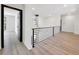 Bright loft area with view of modern chandelier at 191 Darwish Dr, Mcdonough, GA 30252
