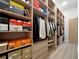 Spacious walk-in closet with custom shelves and hanging racks at 191 Darwish Dr, Mcdonough, GA 30252