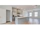 Stylish kitchen featuring gray cabinets, a stainless steel refrigerator, and a central island at 3145 Washburn Sw St, Atlanta, GA 30354