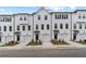Charming townhomes with white siding, black shutters, and one-car garages offer stylish curb appeal at 3149 Washburn Sw St, Atlanta, GA 30354