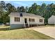 Charming one-story home with a welcoming front porch and well-maintained lawn at 45 Carroll St, Temple, GA 30179