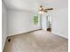 Large bedroom with ample space, neutral carpet, ceiling fan, and ensuite bathroom at 45 Carroll St, Temple, GA 30179