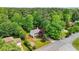 Beautiful aerial view of the property showcasing its well-manicured lawn, mature trees, and neighborhood at 725 Crab Orchard Ct, Roswell, GA 30076