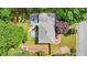 An aerial view of the property shows the stock tank pool and garden with a greenhouse in the backyard at 725 Crab Orchard Ct, Roswell, GA 30076