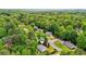 An aerial view of the property nestled within a lush, green, and tranquil neighborhood setting at 725 Crab Orchard Ct, Roswell, GA 30076