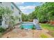 Enjoy your summer in this backyard with its stock tank pool surrounded by lush landscaping at 725 Crab Orchard Ct, Roswell, GA 30076