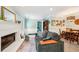 Comfortable living room showcasing a brick fireplace, stylish furnishings, and an open layout at 725 Crab Orchard Ct, Roswell, GA 30076