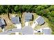 Aerial shot of modern homes featuring driveways and fenced backyards within a well-designed community at 11 Plymouth Ct, Kingston, GA 30145