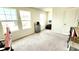 Bright bedroom with neutral carpet, filled with natural light from several windows and features a gray dresser at 11 Plymouth Ct, Kingston, GA 30145