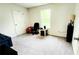Simple bedroom with neutral carpet and black office chair, perfect as a bedroom or home office at 11 Plymouth Ct, Kingston, GA 30145