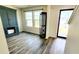 Inviting entryway with hardwood floors, built-in cabinet, and bright windows at 11 Plymouth Ct, Kingston, GA 30145
