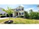 Charming two-story home with a black garage door, neutral siding, and neatly landscaped front yard at 11 Plymouth Ct, Kingston, GA 30145