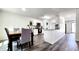 Stylish kitchen and dining area featuring modern appliances, granite counters, and an open floor plan at 11 Plymouth Ct, Kingston, GA 30145