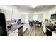 Bright, open kitchen showcasing granite countertops, stainless steel appliances, and an inviting dining space at 11 Plymouth Ct, Kingston, GA 30145