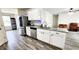 Contemporary kitchen boasting granite countertops, stainless appliances, and seamless transition to living area at 11 Plymouth Ct, Kingston, GA 30145