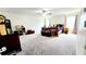 Spacious main bedroom with neutral carpet, ceiling fan and large bed, offering a comfortable and relaxing retreat at 11 Plymouth Ct, Kingston, GA 30145