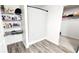 Walk-in closet with wooden-style flooring, offering ample space for storage and organization at 11 Plymouth Ct, Kingston, GA 30145