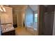 Bathroom featuring double sinks, soaking tub, and separate shower, offering a spa-like experience at 1395 Kala Dr, Lithonia, GA 30058