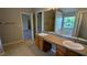 Bathroom with double sinks, generous counter space and a soaking tub to create a functional space at 1395 Kala Dr, Lithonia, GA 30058