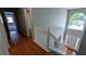 Bright entryway featuring hardwood floors, staircase and large window at 1395 Kala Dr, Lithonia, GA 30058