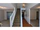Stairway in the entryway with hardwood and carpet flooring at 1395 Kala Dr, Lithonia, GA 30058