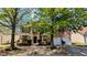 Charming two-story brick home with a two-car garage and a well-manicured front yard at 1395 Kala Dr, Lithonia, GA 30058