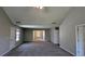 Large living room with neutral walls, carpet and ample natural light, creating a welcoming atmosphere at 1395 Kala Dr, Lithonia, GA 30058