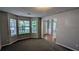 Sunlit living room featuring new carpeting and multiple windows at 1395 Kala Dr, Lithonia, GA 30058