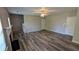 Spacious living room featuring modern wood flooring and a ceiling fan at 1395 Kala Dr, Lithonia, GA 30058
