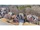 Aerial view of a neighborhood showcasing well-maintained homes and mature trees at 4802 Moon Chase Dr, Buford, GA 30519