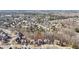 Aerial view of a residential area with neatly arranged homes and tree coverage at 4802 Moon Chase Dr, Buford, GA 30519