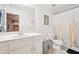 Bright bathroom featuring a toilet, vanity, and decorative shower curtain at 4802 Moon Chase Dr, Buford, GA 30519