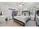 Bedroom featuring a dark wood bed frame, clothing rack, and natural light at 4802 Moon Chase Dr, Buford, GA 30519