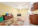 Spacious bonus room with tile floors and colorful rug, ideal for a playroom or entertainment area at 4802 Moon Chase Dr, Buford, GA 30519