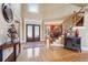 Grand foyer with hardwood floors, a staircase, and a view into the formal dining room at 4802 Moon Chase Dr, Buford, GA 30519