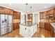 Spacious kitchen features stainless steel appliances, a kitchen island, and lots of cabinet storage at 4802 Moon Chase Dr, Buford, GA 30519