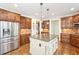 Spacious kitchen features stainless steel appliances, a kitchen island, and lots of cabinet storage at 4802 Moon Chase Dr, Buford, GA 30519